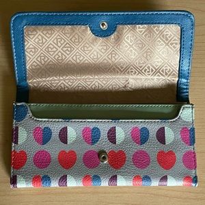 Relic wallet. All manmade. 14 card slots. 3 cash pockets and a zipper pocket.